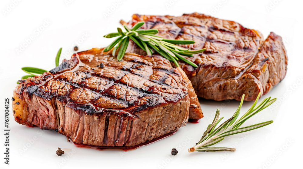 Grilled beef steaks seasoned and isolated on white background. Grilled beef steaks seasoned and isolated on white background.