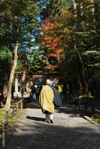 Monk walking on the path photo