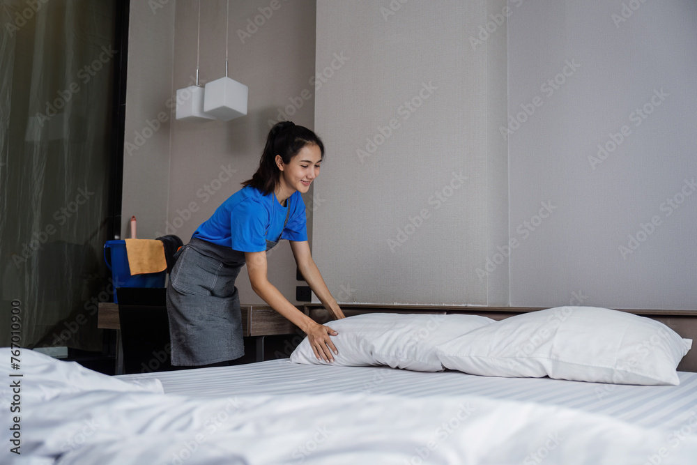cleaning service woman worker clean bedroom at home. housekeeper cleaner feel happy and make bed look neat. housework and housekeeping cleaning service cleaning service woman worker clean bedroom at home. housekeeper cleaner feel happy and make bed look neat. housework and housekeeping cleaning service
