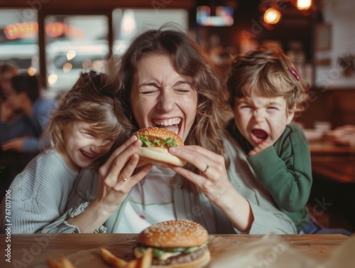 a woman smiling and eating a burger while her childrens are crying around her