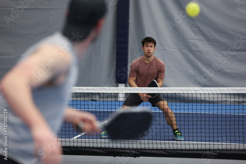 Pickleball singles tournament action photo