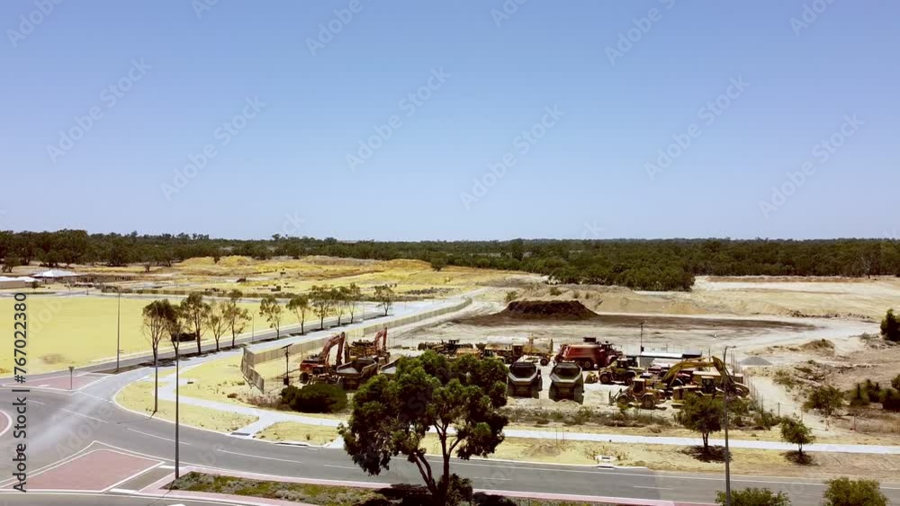 Wide view of large construction vehicles at new housing development Catalina Green, Perth Wide view of large construction vehicles at new housing development Catalina Green, Perth