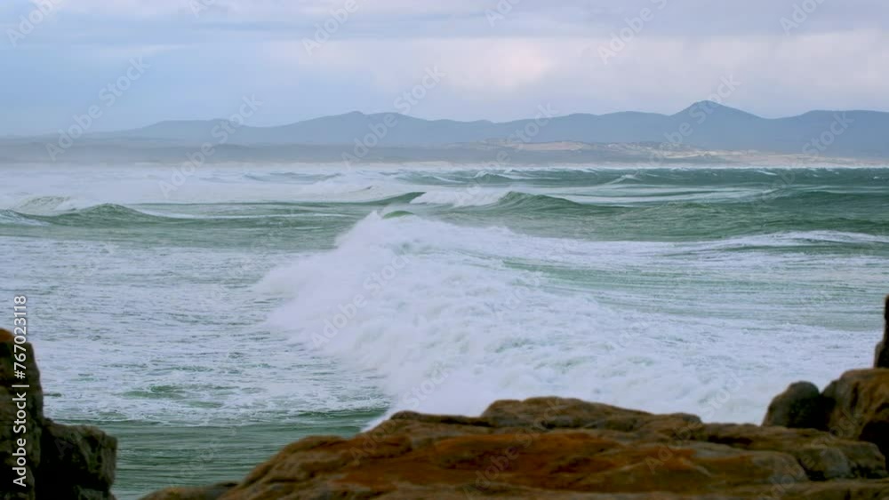 Relaxing view of waves rolling in to Walker Bay in Hermanus in stormy weather Relaxing view of waves rolling in to Walker Bay in Hermanus in stormy weather