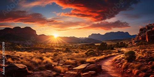 a sunset over a desert landscape photo
