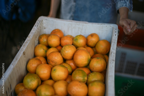 selective focus, tangerine, large, beautiful skin Specially selected oranges in orange baskets Sold at a special price by Thai farmers