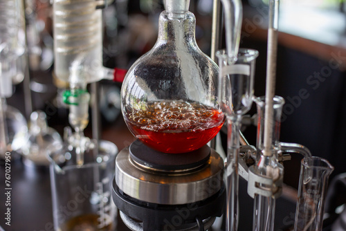 Selective focus glass liquid distillation equipment Siphon coffee-making Americano coffee shops use science tubes to make coffee.. photo