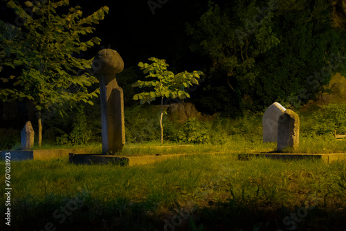 A dramatic image of the tombstones of Muslim graves in front of the historic Orhangazi Mosque, located below the Sheikh Edebali Tomb in Bilecik. photo