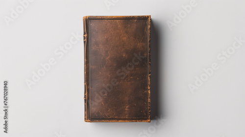 Mock-up of a book with blank brown leather cover on a plain white background. Classic old book style in front view.