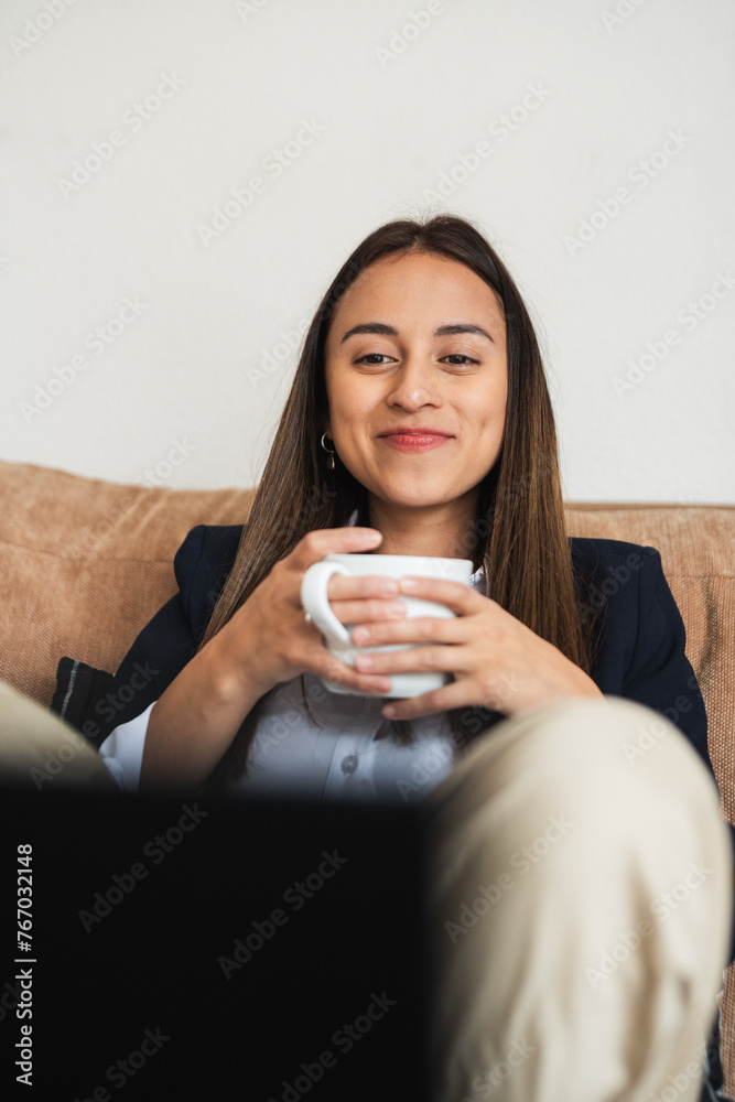 Smiling businesswoman enjoying a coffee break Smiling businesswoman enjoying a coffee break