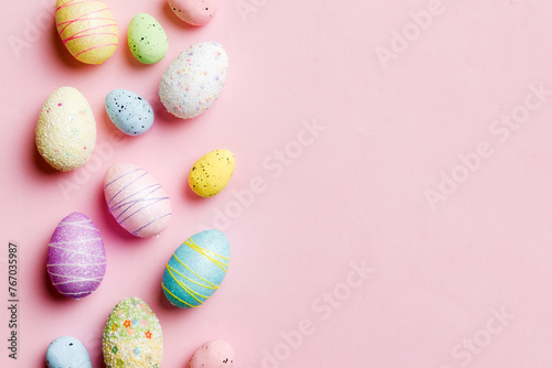 Happy Easter concept. Preparation for holiday. Easter eggs on colored background. flat lay top view copy space banner
