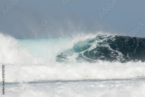 Surfer conquering a magnificent ocean wave photo
