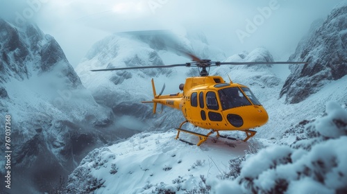   Yellow helicopter perched atop snow-capped peak beside tranquil body of water and distant mountain range photo