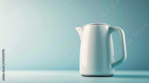 A simple and elegant electric kettle. It has a white body and a black handle. The kettle is sitting on a white table against a pale blue background.