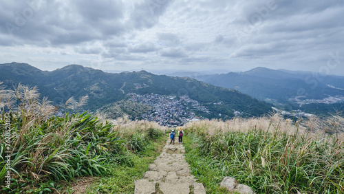 Two hikers at Keelung Mountain in Juifen, Taiwan