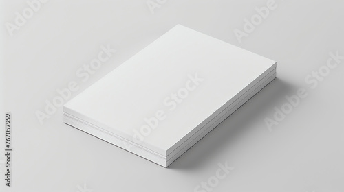 A stack of three blank books on a solid white background. The books are different sizes, with the largest on the bottom and the smallest on top. photo