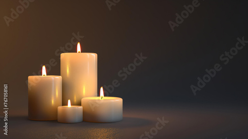 Four candles with a dark background. The candles are different sizes and are arranged in a staggered formation.