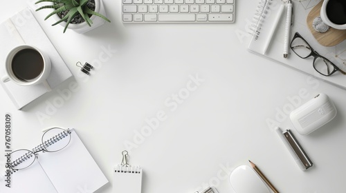 The top view of a white office desk table with a blank notebook, a computer keyboard, and other office supplies is expressed flat, with the copy space at the top. photo
