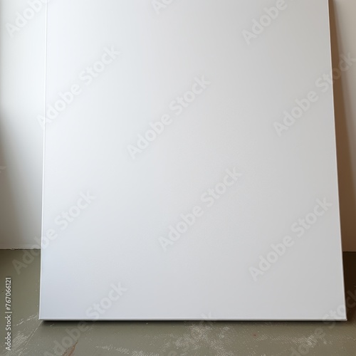Blank rectangular canvas with a slope standing on the floor, mockup