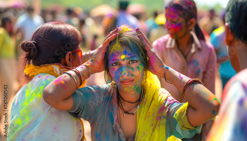 Young people have fun at a festival of colors. Young people participate in a face painting festival.