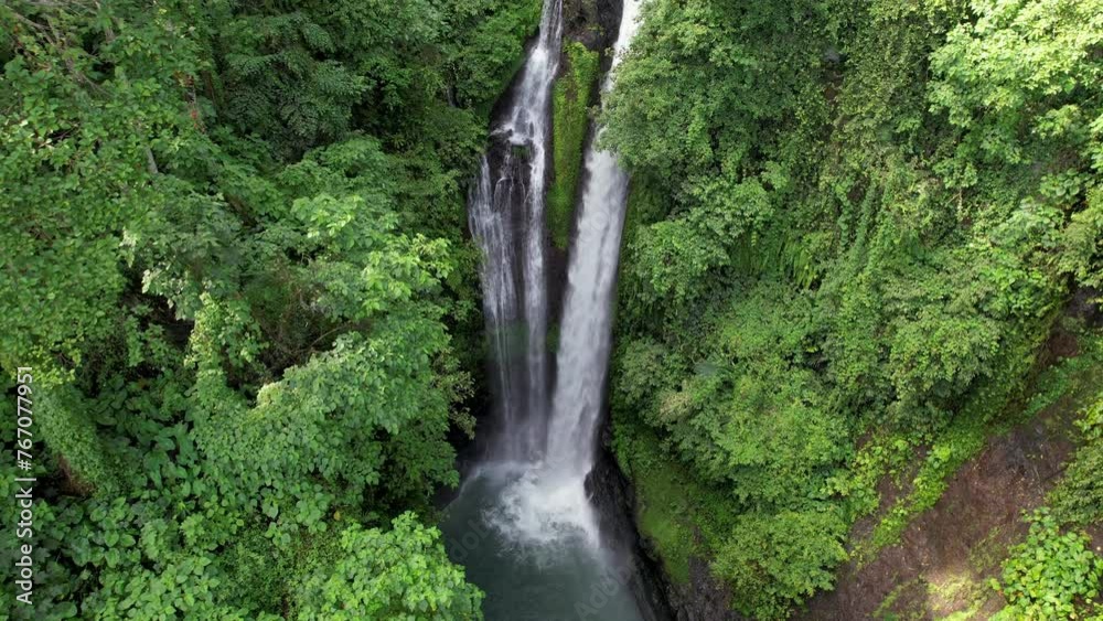 Tilt down drone shot of Aling Aling waterfall. Bali, Indonesia. Tilt down drone shot of Aling Aling waterfall. Bali, Indonesia.