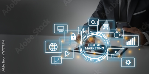 A businessman with digital marketing icons on a virtual screen online commerce and business strategy, technology business, virtual interaction, online marketing concept