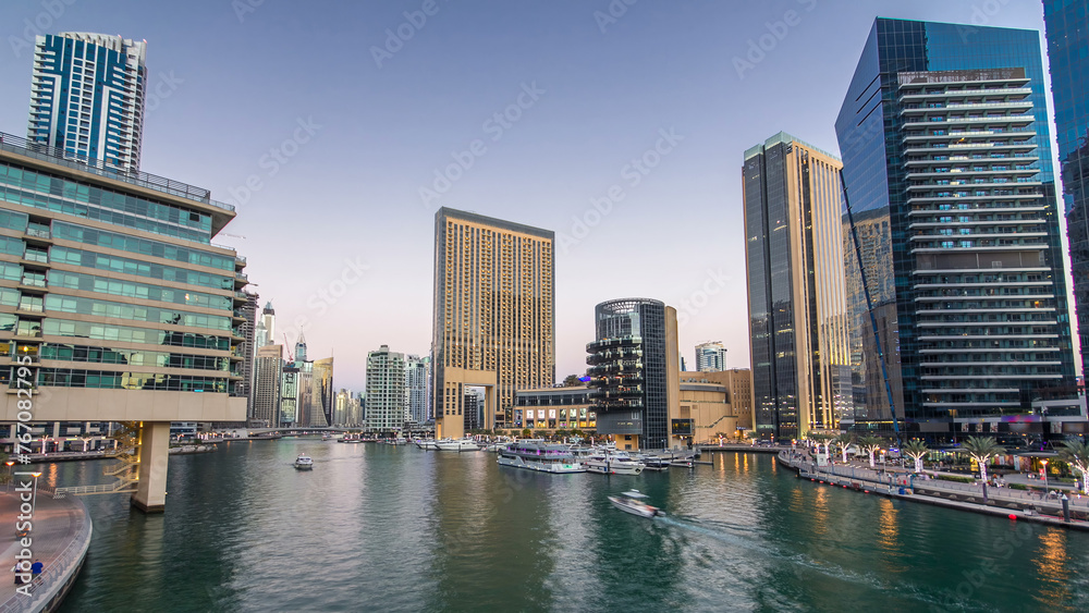 Dubai Marina towers and canal in Dubai day to night timelapse