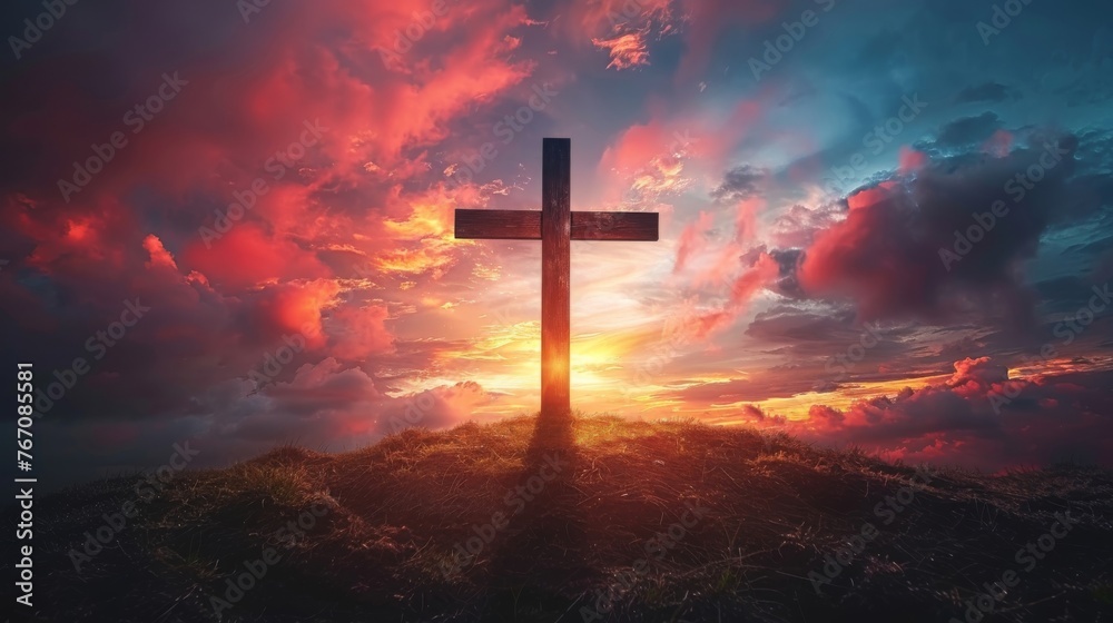Fototapeta premium A Holy cross silhouetted against a dramatic sunset, symbolizing the death and resurrection of Jesus Christ 
