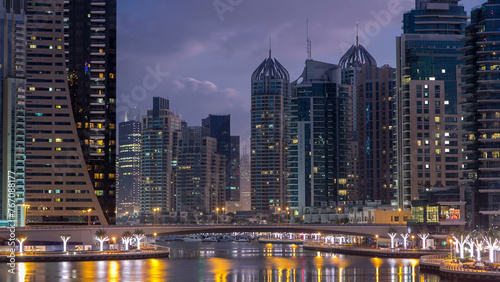 Dubai Marina towers and canal in Dubai night to day timelapse © neiezhmakov