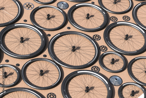 Intricate Pattern of Bicycle Wheels and Gears on Textured Beige Background