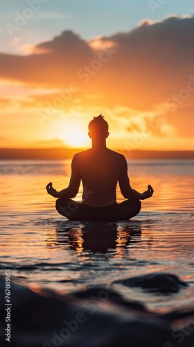 Man in yoga pose, zen meditation at sunset  © CREATIVE STOCK