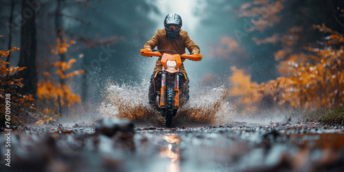 man racer on a sport enduro motorcycle riding in race in on dirty mud forest road © alexkoral