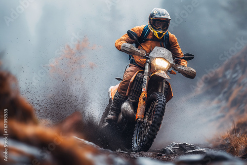 man motorcycle biker racer on sports enduro motorcycle in off-road race rally riding on dirty road in nature © alexkoral