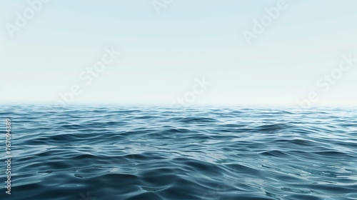 The image is a beautiful seascape. The deep blue water is crystal clear and sparkles in the sunlight.