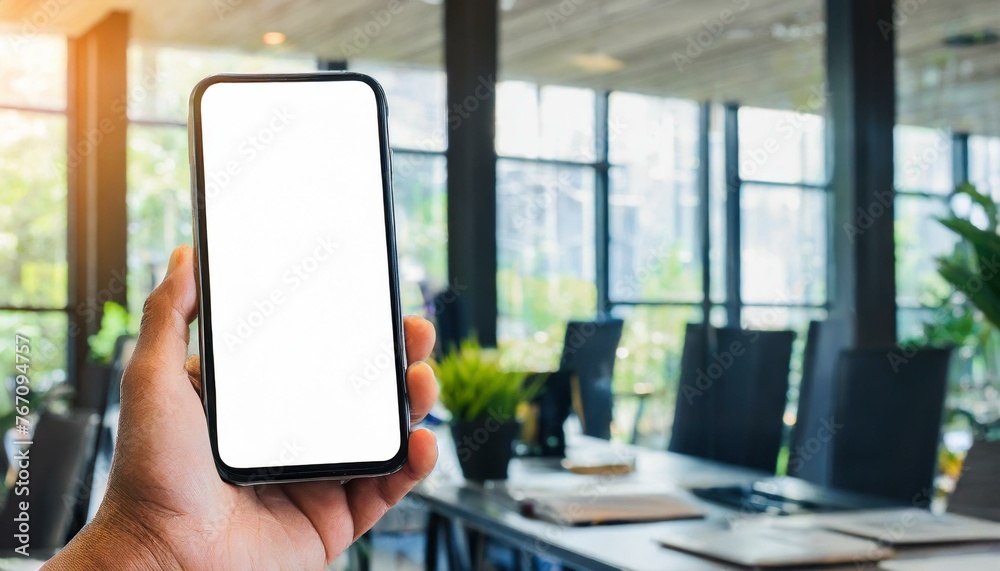 Mobile Phone for Mockup - Mobile Phone held by Hand in an Office or Cafe Environment - Template for Application Presentation Mobile Phone for Mockup - Mobile Phone held by Hand in an Office or Cafe Environment - Template for Application Presentation