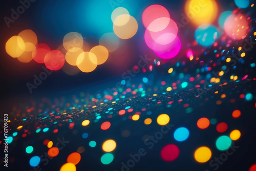 Black background with colorful, fabulous bokeh. Abstract background with shining circles of light. Fairytale dream in the dark.