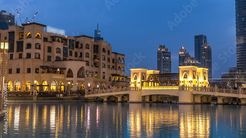 The bridge near the biggest musical fountain in Dubai day to night timelapse. Dubai, UAE