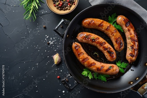 Barbecue sausages in frying pan.