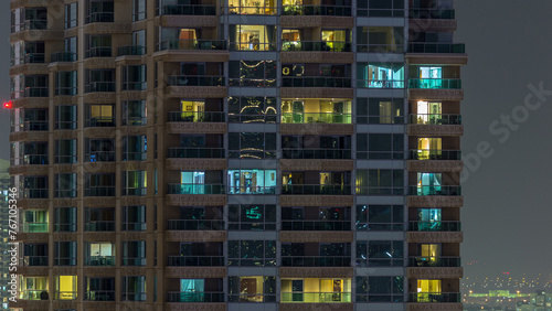 Scenic glowing windows of skyscrapers at evening timelapse