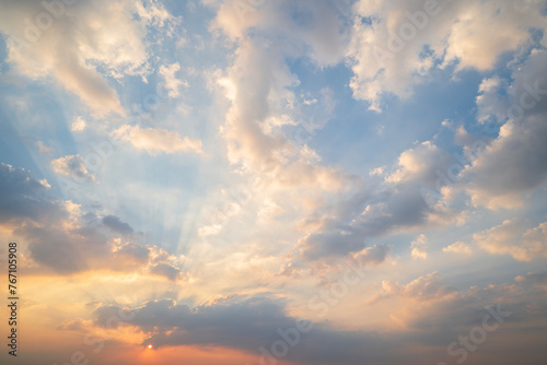 sunset or sun rise sky with rays of light shining clouds and sky background and texture