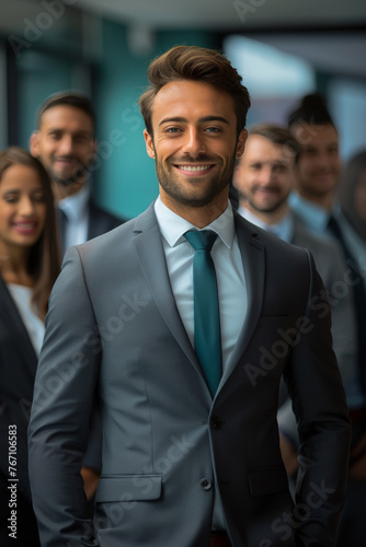 A man in a suit and tie smiles for the camera
