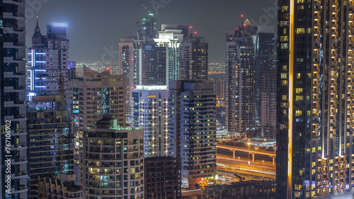 Dubai Marina and JLT at night timelapse, Glittering lights and tallest skyscrapers © neiezhmakov