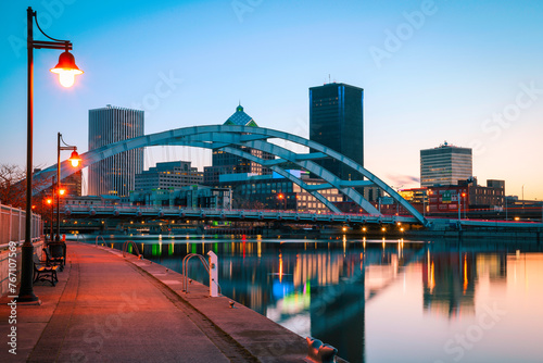 Rochester New York Skyline, Skyscrapers, Water Reflections, Court Street Bridge Arching over the Genesee River along the Boardwalk on the Genesee Riverway Trail at Twilight photo