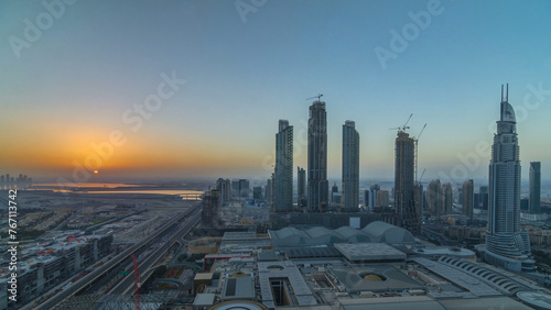 Dubai downtown with sunrise timelapse. Top view from above