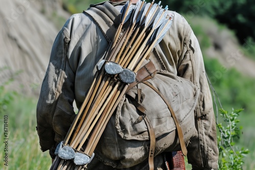 hunter with stonetipped arrows in a quiver on back photo