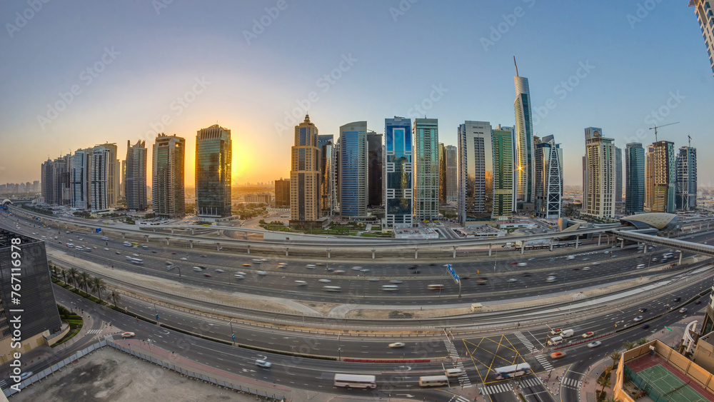 Aerial view of Jumeirah lakes towers skyscrapers at sunrise timelapse with traffic on sheikh zayed road. Aerial view of Jumeirah lakes towers skyscrapers at sunrise timelapse with traffic on sheikh zayed road.