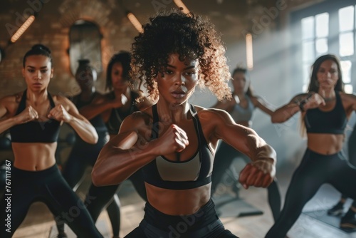 Focused women practicing self-defense in a gym