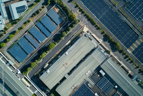 A birds eye view of a parking lot filled with rows of solar panels harnessing energy under the suns rays