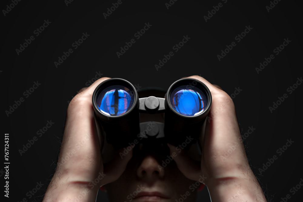 Mysterious Individual Intently Searching Horizon with Binoculars in Twilight