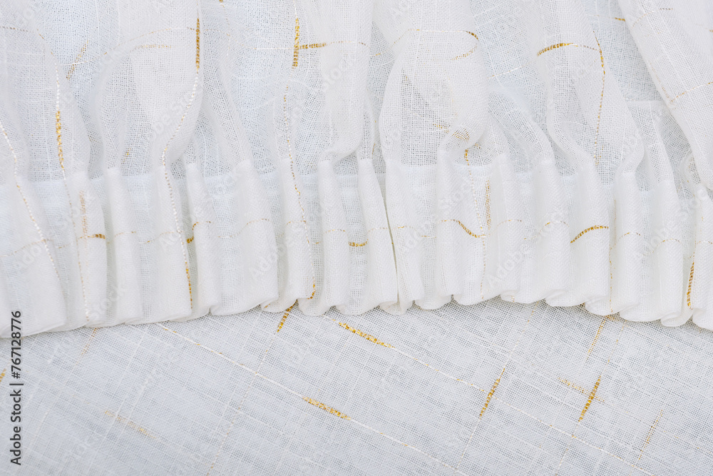 Frills of white fabric. Flounces and ruffles of delicate curtains. Frills of white fabric. Flounces and ruffles of delicate curtains.