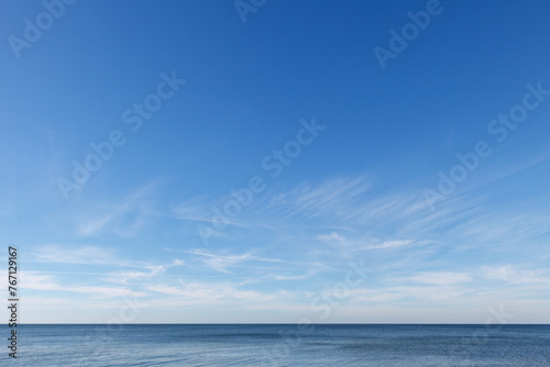 Photography Beautiful blue sky over the sea with translucent, white, Cirrus clouds